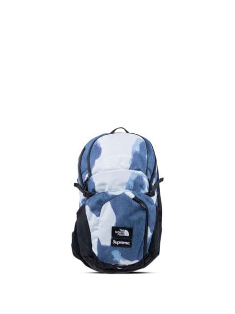 x The North Face bleached denim print backpack